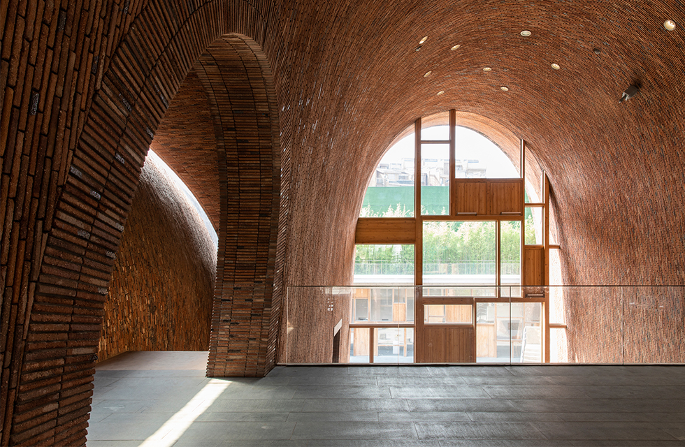 Natural light inside is achieved through skylights, inspired by the chimney of ancient brick kilns. Jingdezhen Imperial Kiln Museum